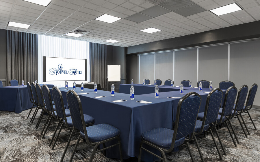 a conference room with a table and chairs