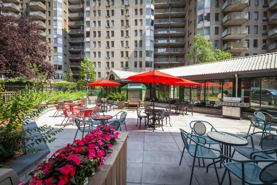 a patio area with tables and umbrellas